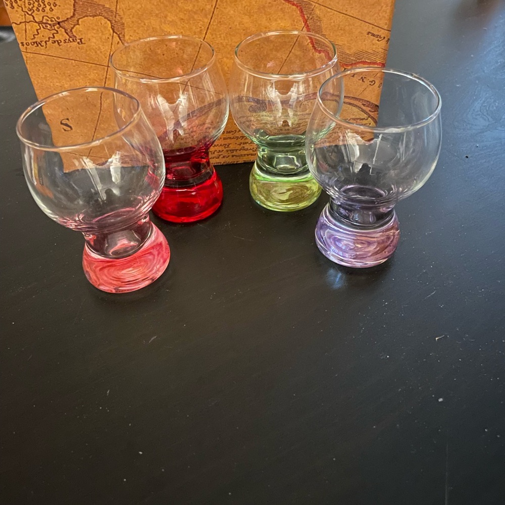 Four bottom colored liqueur glasses